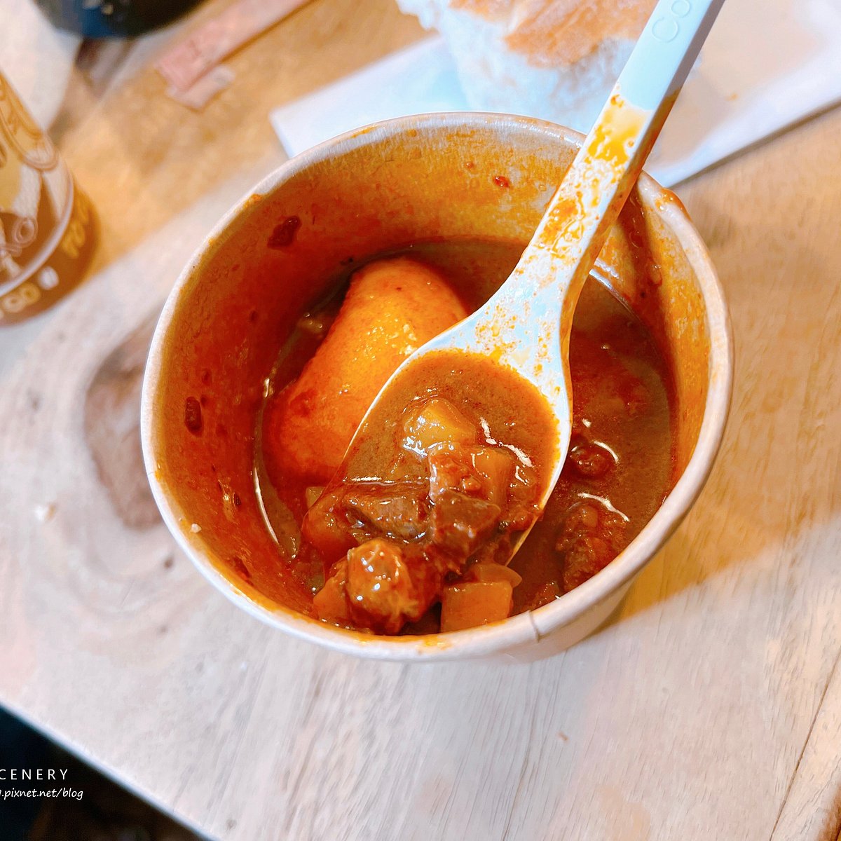 Cup of goulash soup served with bread